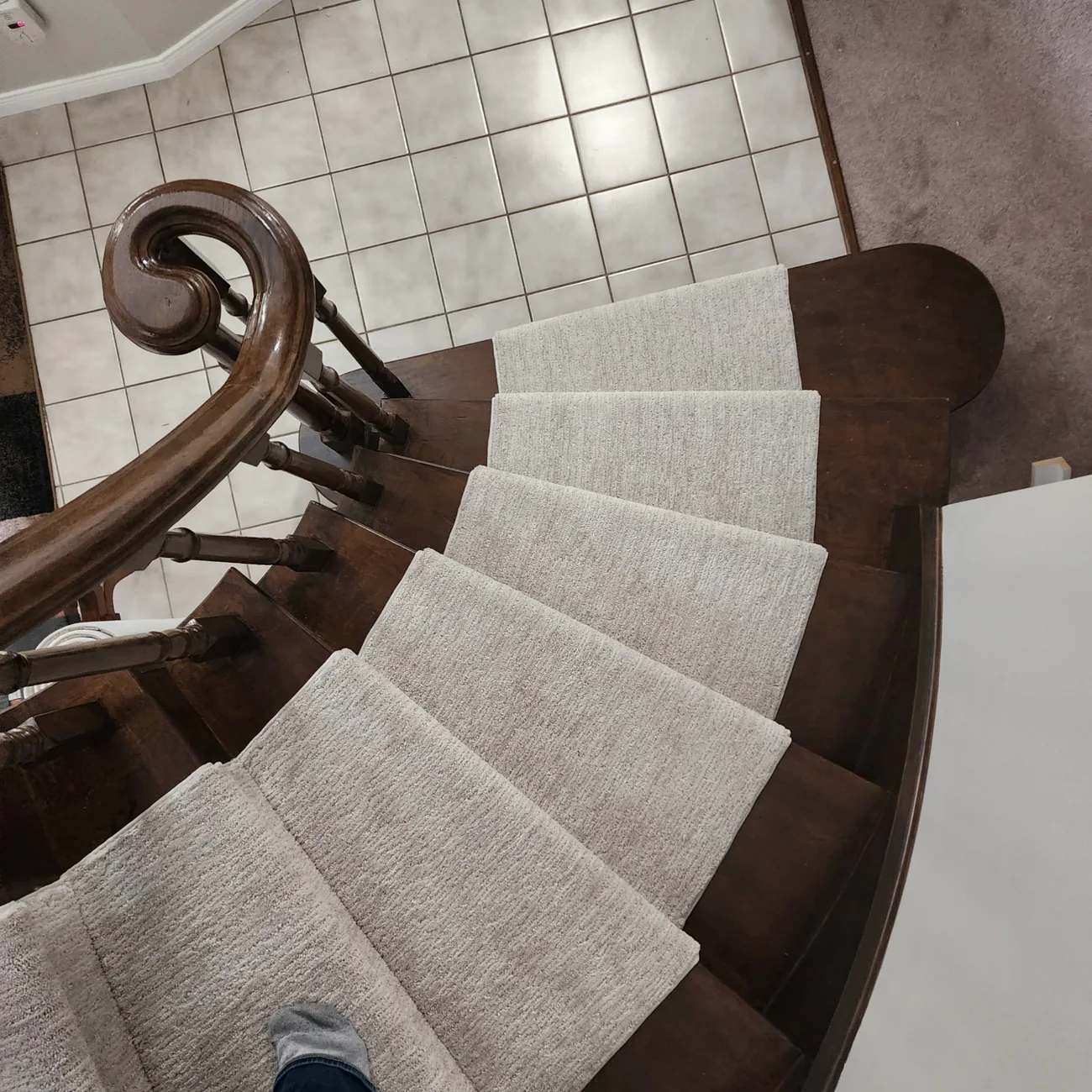 Carpeted curved staircase installed by JD Flooring in North Bay