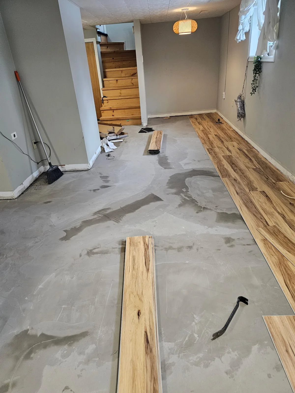 Hickory hardwood planks installed over a leveled concrete subfloor by JD Flooring