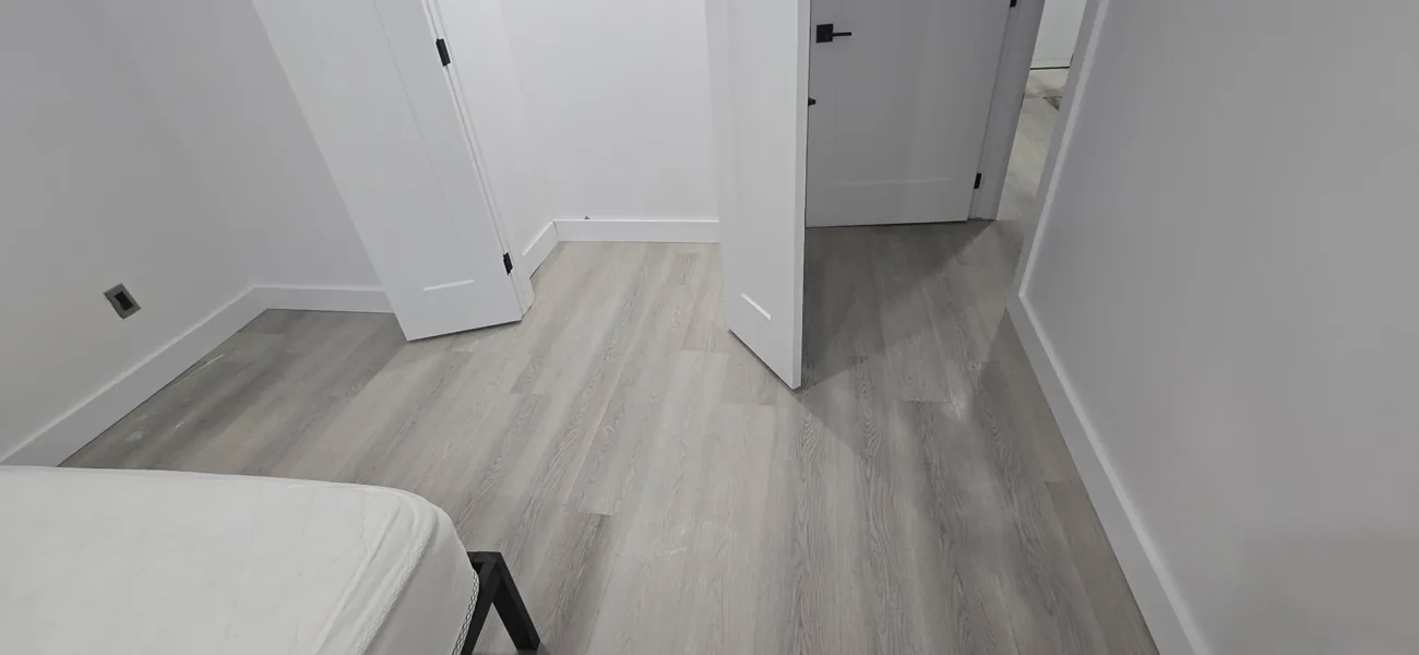 Laminate flooring in a North Bay bedroom installed by JD Flooring