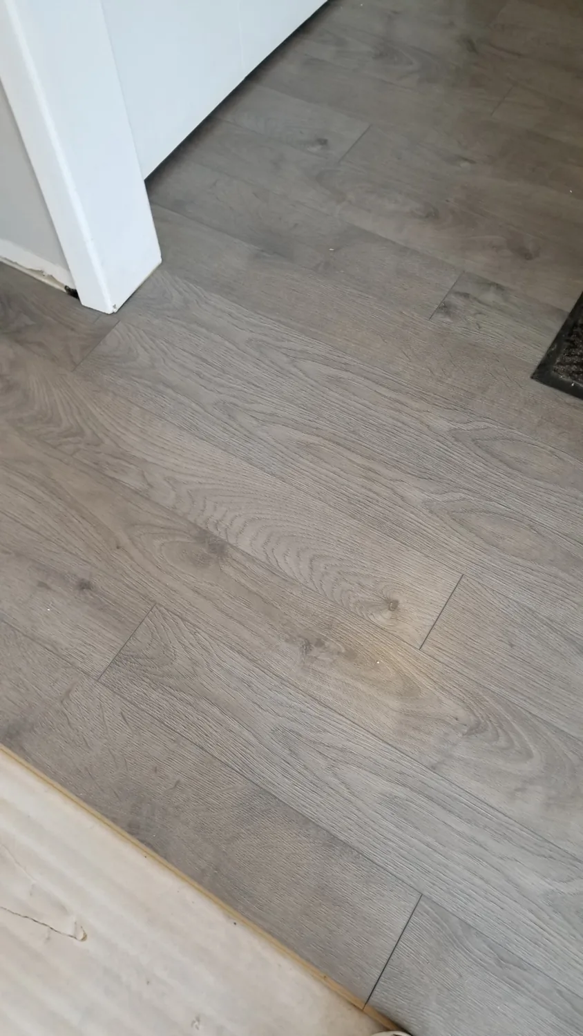 Finished laminate plank flooring installed by JD Flooring in North Bay