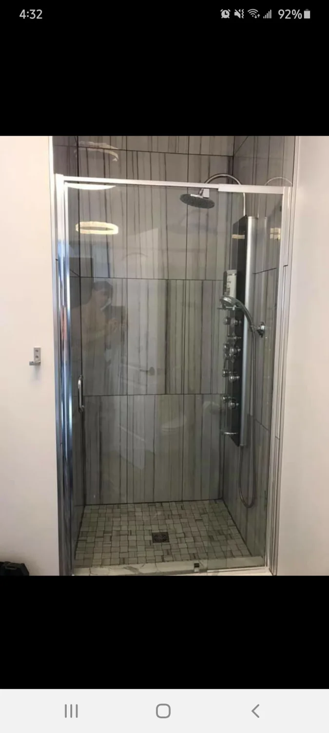 Finished glass and tiled shower installed by JD Flooring in North Bay