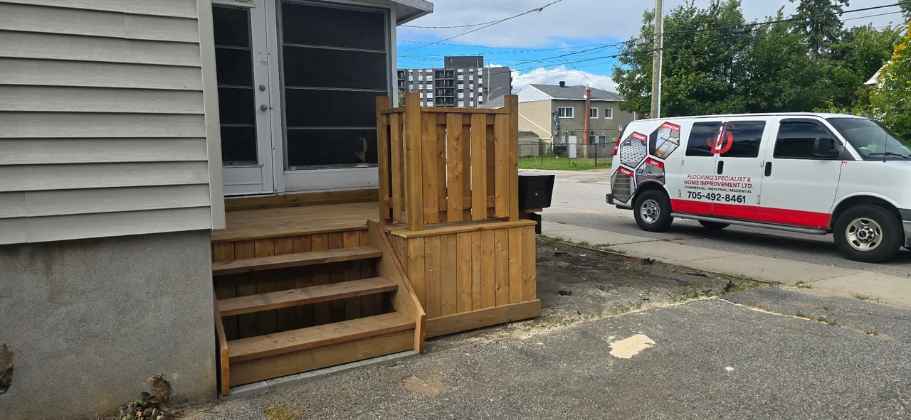 Cedar wood deck, steps and privacy fence built by JD Flooring in North Bay
